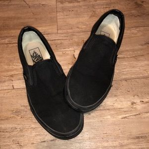 All black slip-on vans